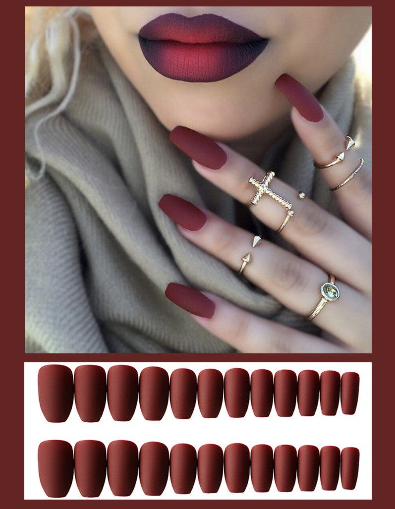 Complete acrylic press on nails kit with glue and application tools.