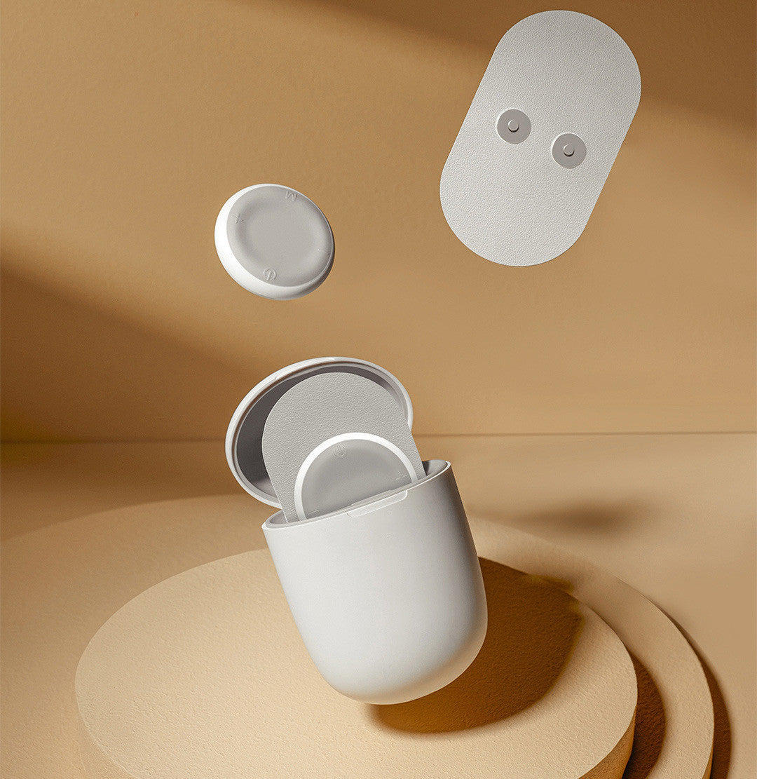 Electric massage pad wireless TENS machine in white with adhesive patches