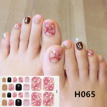 Gel sticker nails for toes in packaging showing resin nail art designs.