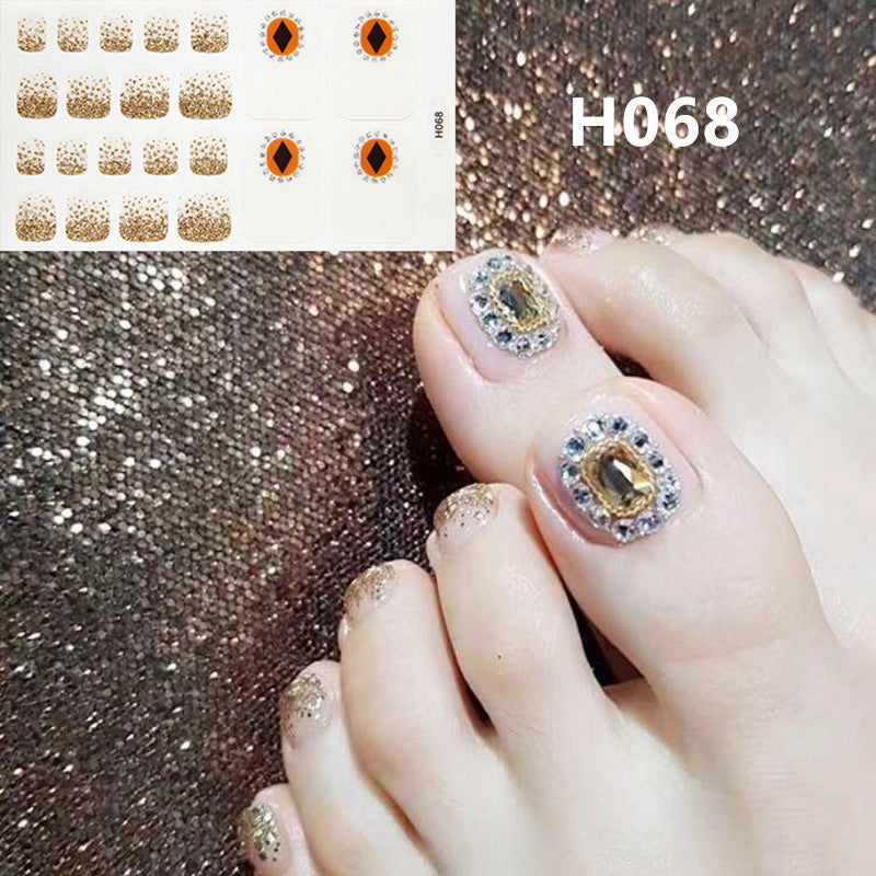 Gel sticker nails for toes in packaging showing resin nail art designs.