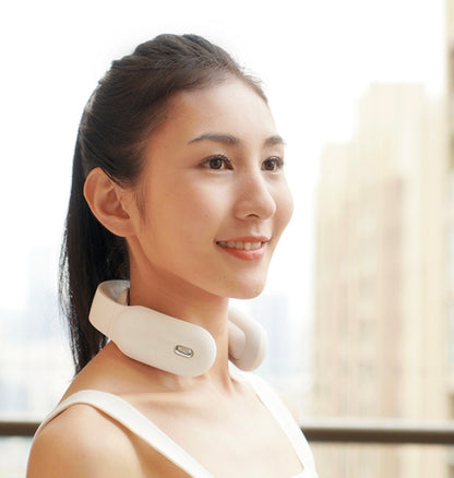Neck massager with heat providing tension headache relief to user